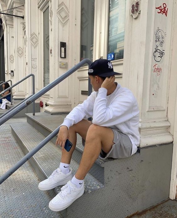 man with shorts and AF1
