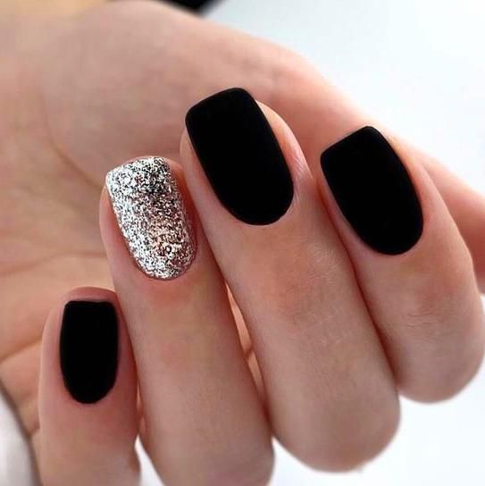 black and glitter nail design