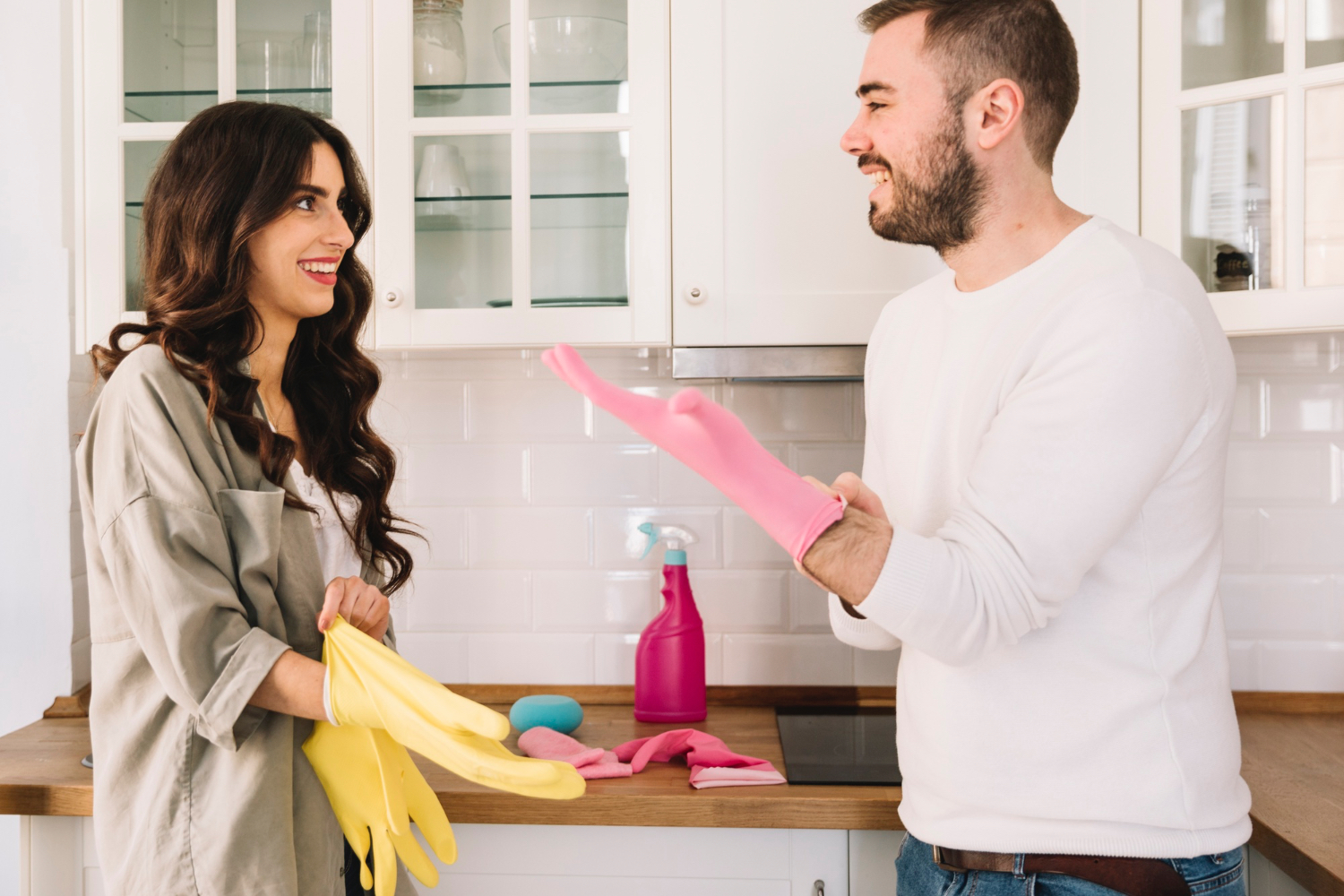 Couple doing chores together cooking and cleaning