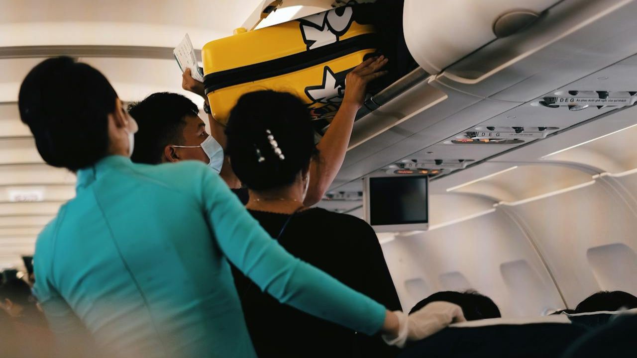 Overhead Bin Secrets Flight Attendants Want Every Traveler to Know