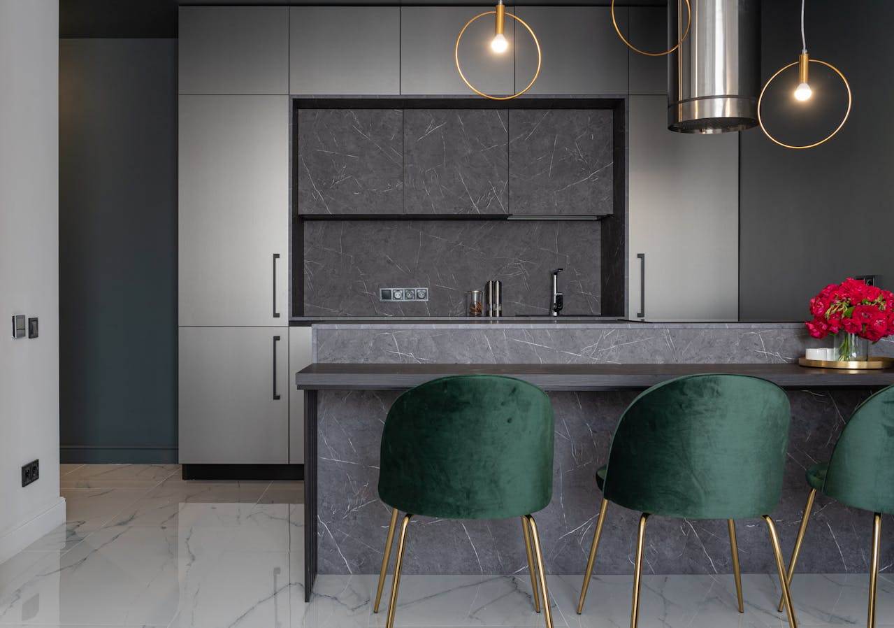 Dark Woods, Stone, And Heirloom Kitchens