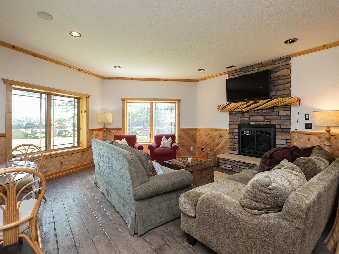 Cozy living room with fireplace and wood accents