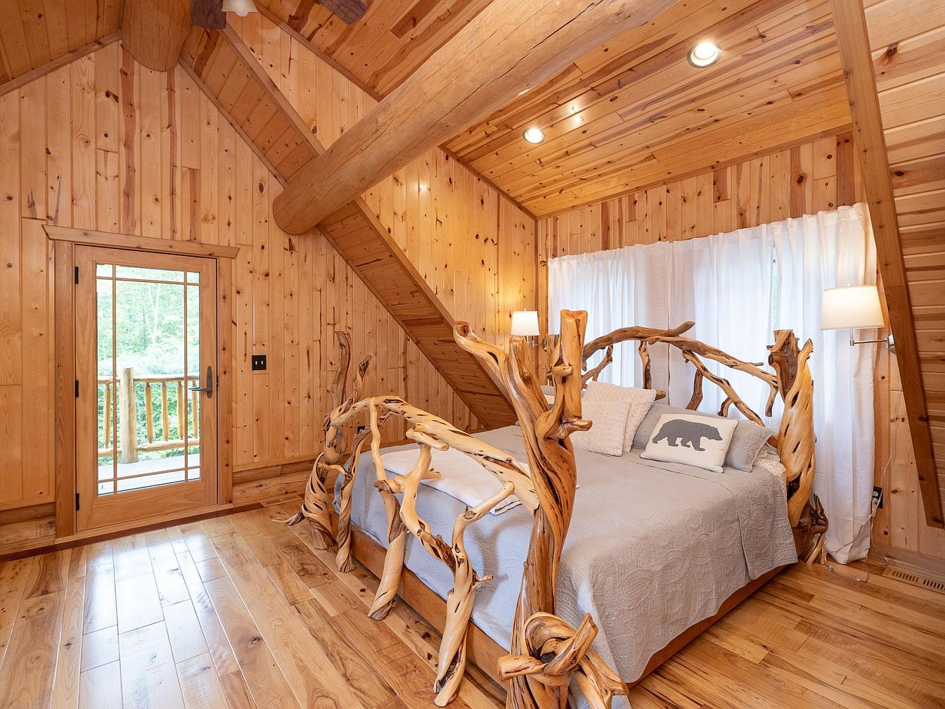 Master bedroom retreat with tree-branch bed