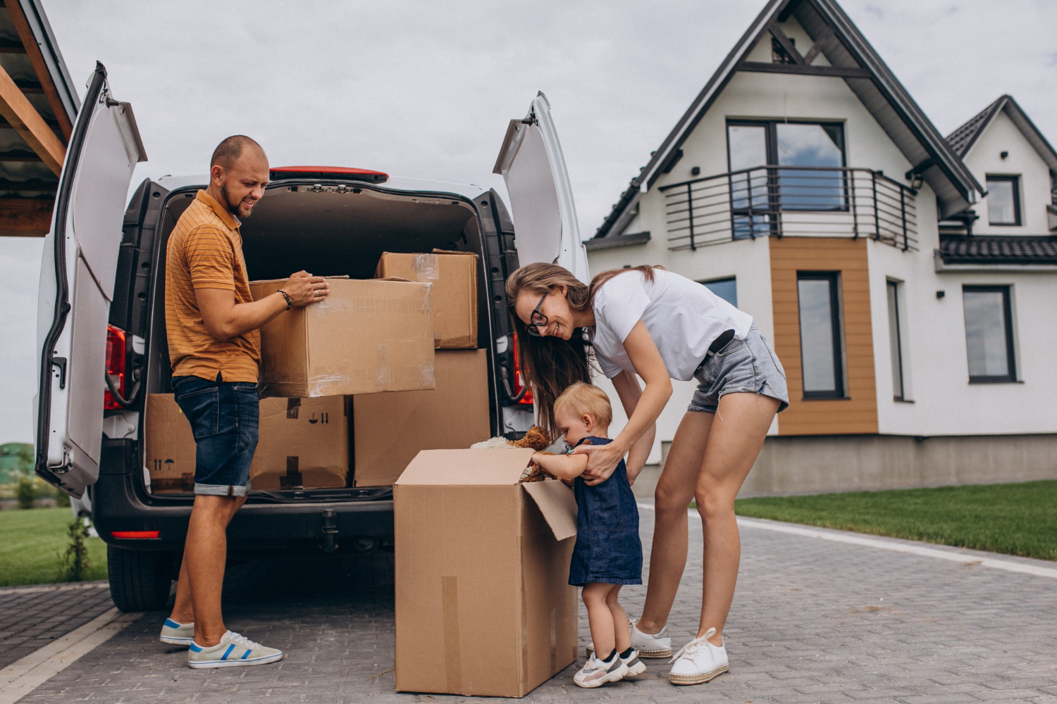 family loading moving truck